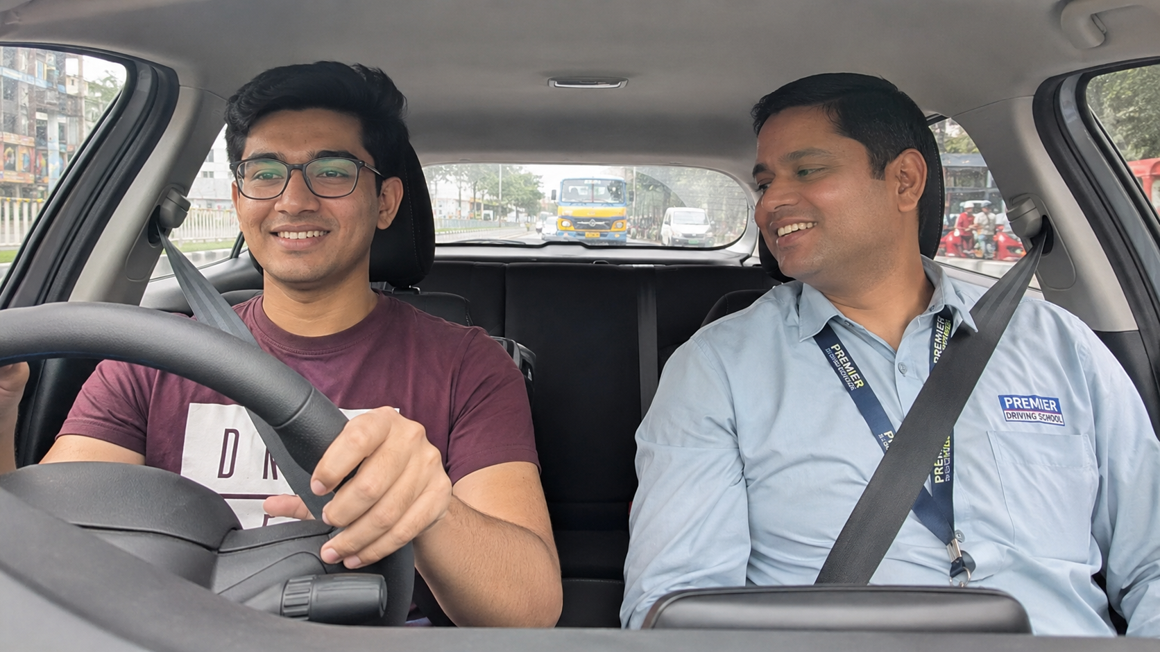 Student learning driving with instructor at Dhanush Motor Driving School Bangalore
